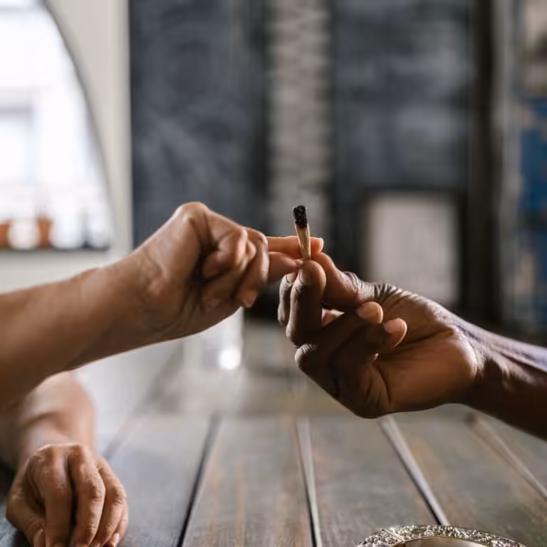 Person Holding a Joint